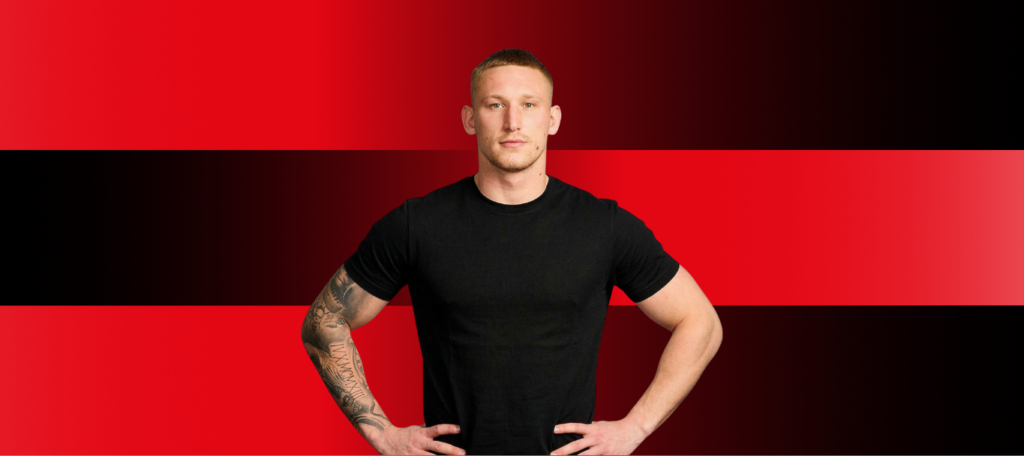 Mikolaj Oledzki in a black tshirt on a red and black background