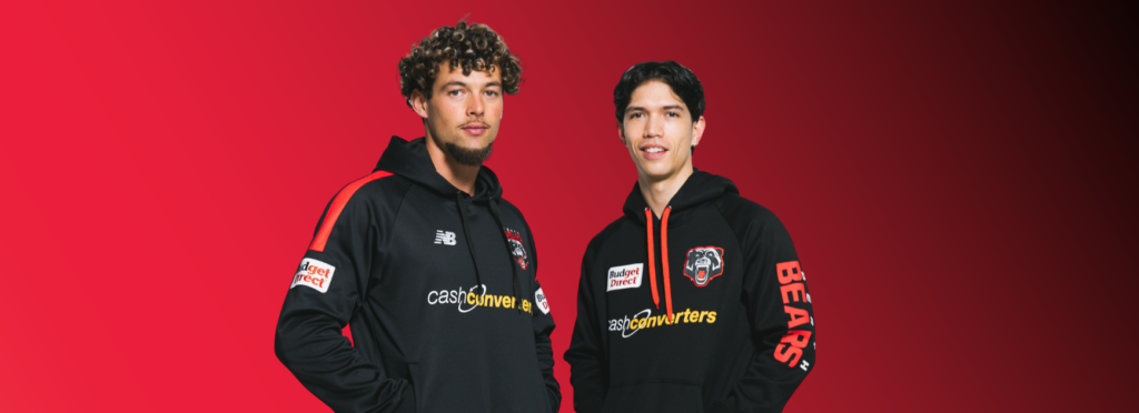 Image of two men wearing Perth Bears black hoodies