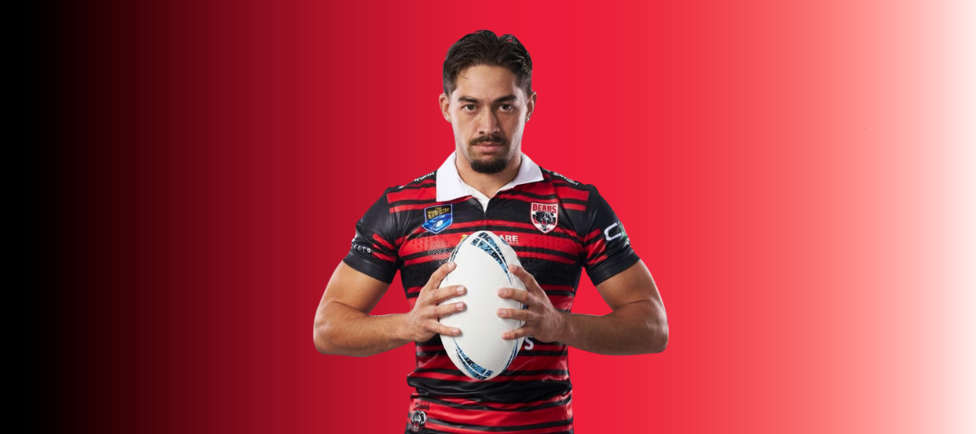 Image of AG Gudgeon holding a footy ball, wearing North Sydney Bears jersey
